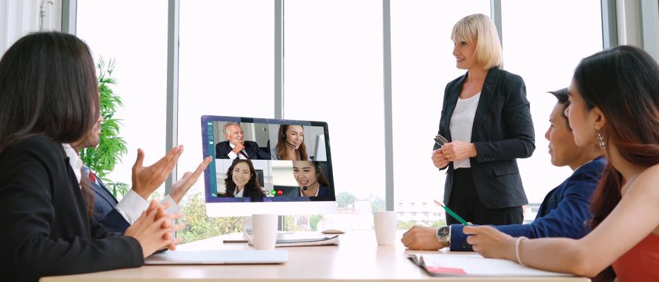Group of people in conference room in a video chat