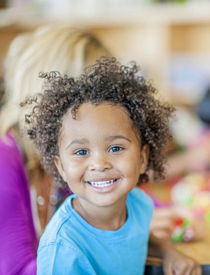 Boy in preschool smiling